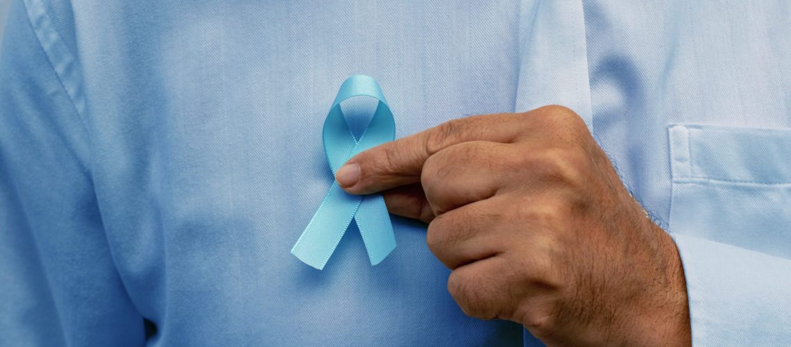 Blue november - man holding blue ribbon